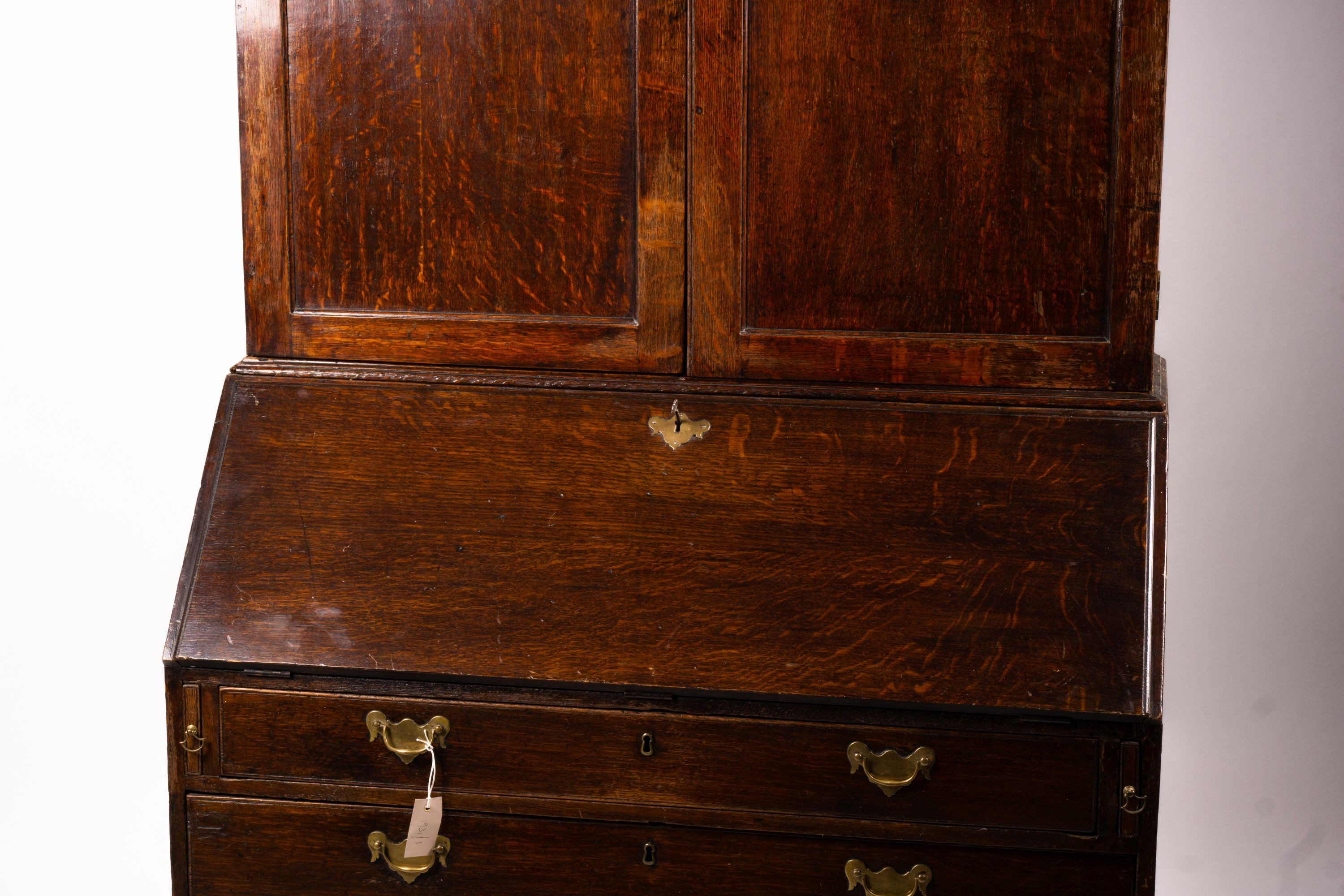 A George III oak bureau cabinet, width 108cm, depth 52cm, height 209cm